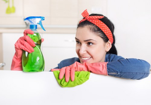 Technician using carpet cleaning equipment in a commercial space