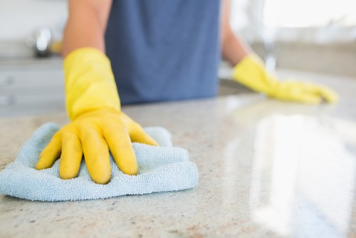 Technician performing deep upholstery cleaning with extraction equipment